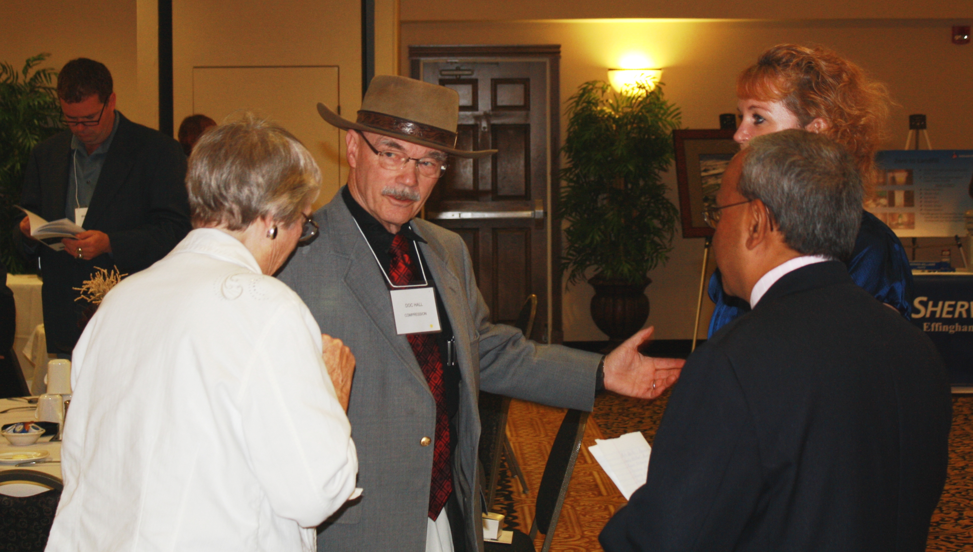 Doc Hall and his wife speak to Deb Jacobson and Manohar Kulkarni Doc Hall and his wife speak to Deb Jacobson and Manohar Kulkarni