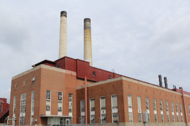 Abbott Power Plant: brick building with tall think windows and two smoke stacks.