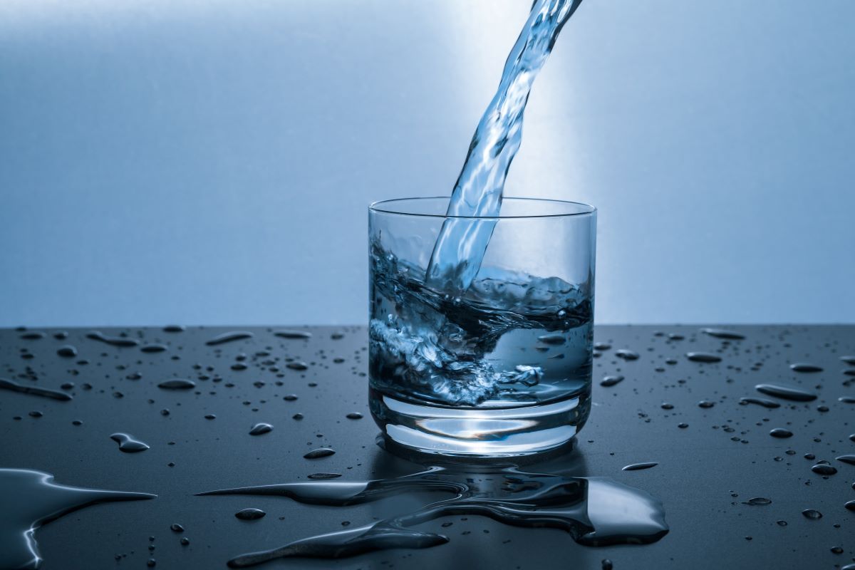 pristine water pouring into a clear glass